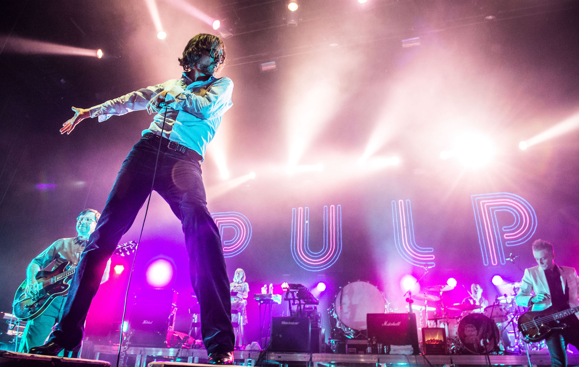 Jarvis Cocker performing live onstage with Pulp in 2012