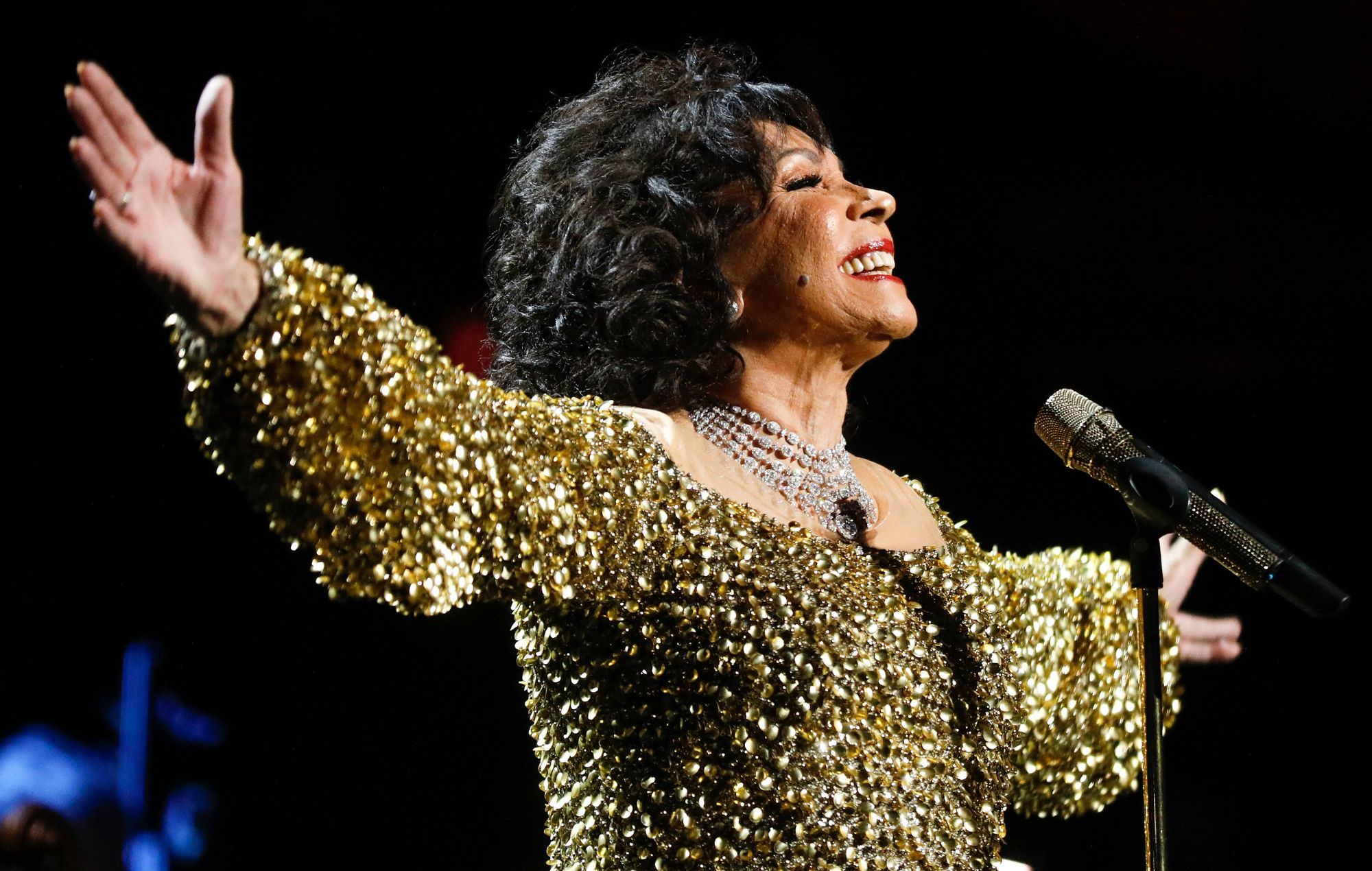 Dame Shirley Bassey performs on stage accompanied by The Royal Philharmonic Concert Orchestra